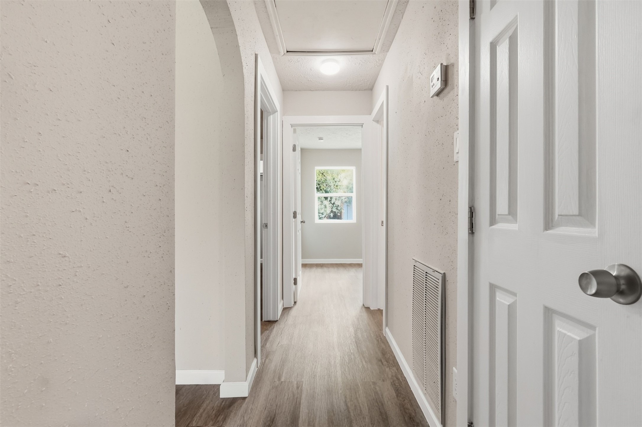 4767 Beechaven Street Houston, TX 77053 - Photo 23 of 26 a view of a hallway with wooden floor and staircase