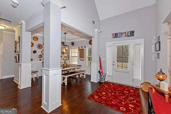 a bedroom with furniture and a window