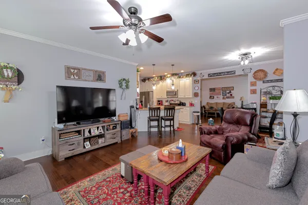 a living room with furniture and a flat screen tv