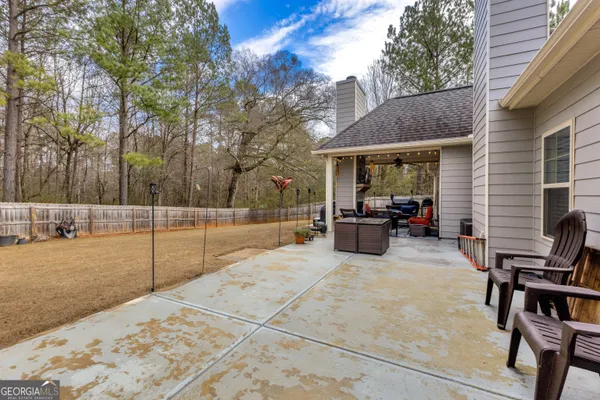 a view of a backyard with a patio