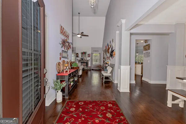 a view of an entryway with wooden floor