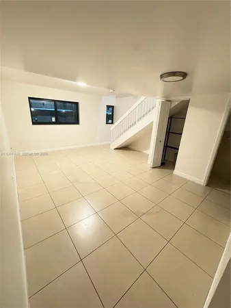 a view of a livingroom with white furniture