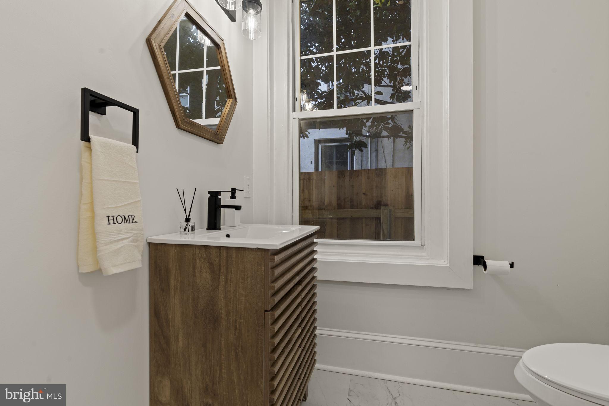 147 Harvey Street Philadelphia, PA 19144 - Photo 11 of 37 a bathroom with a sink and a mirror