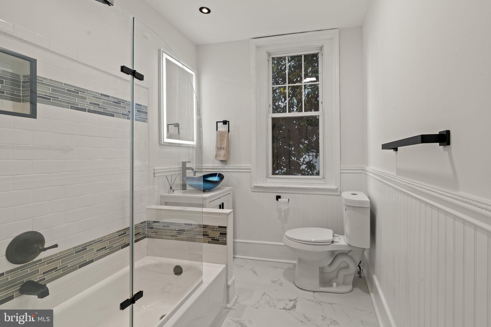 147 Harvey Street Philadelphia, PA 19144 - Photo 13 of 37 a bathroom with a bathtub toilet and sink