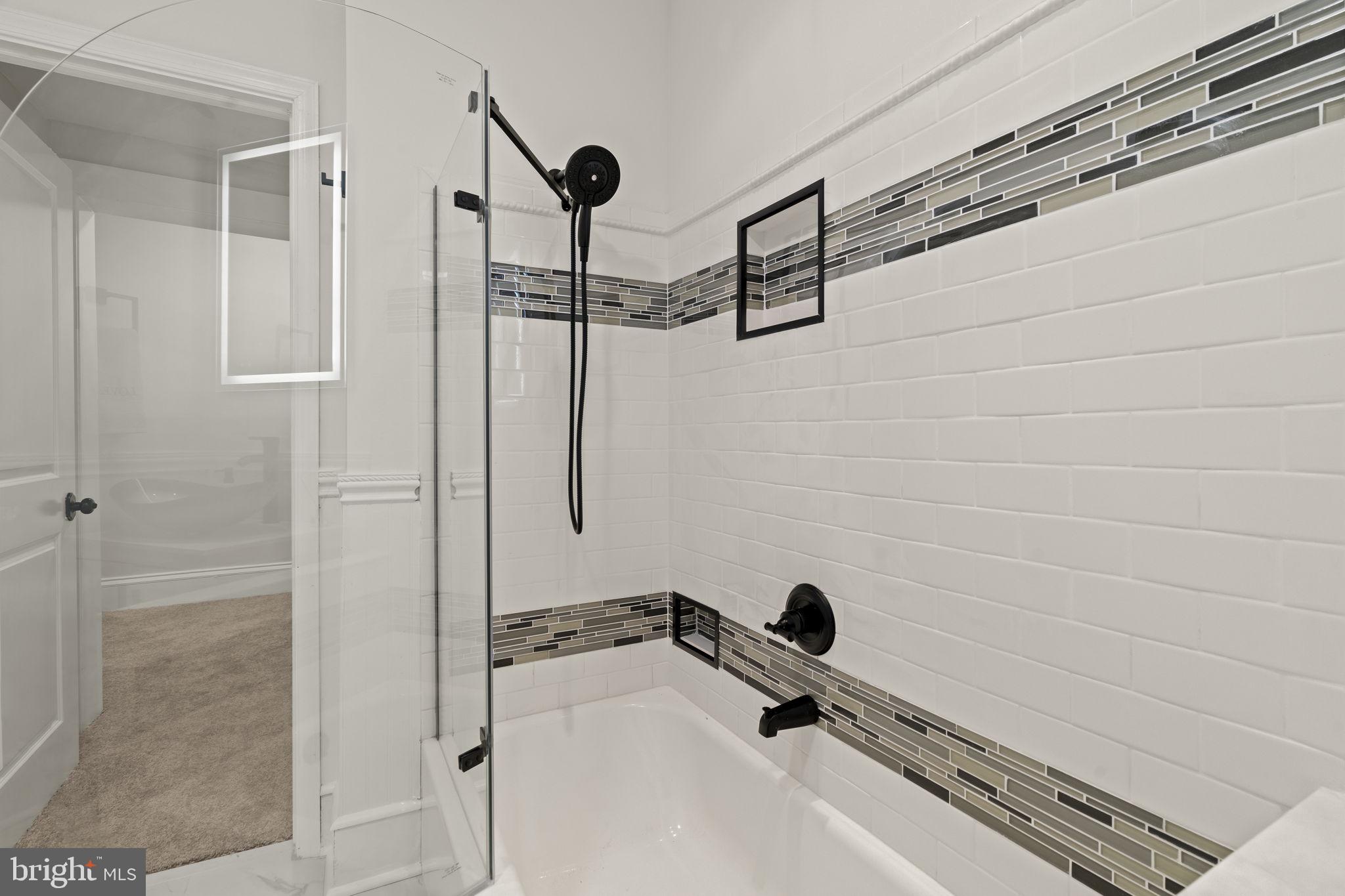 147 Harvey Street Philadelphia, PA 19144 - Photo 14 of 37 a bathroom with a tub and a shower