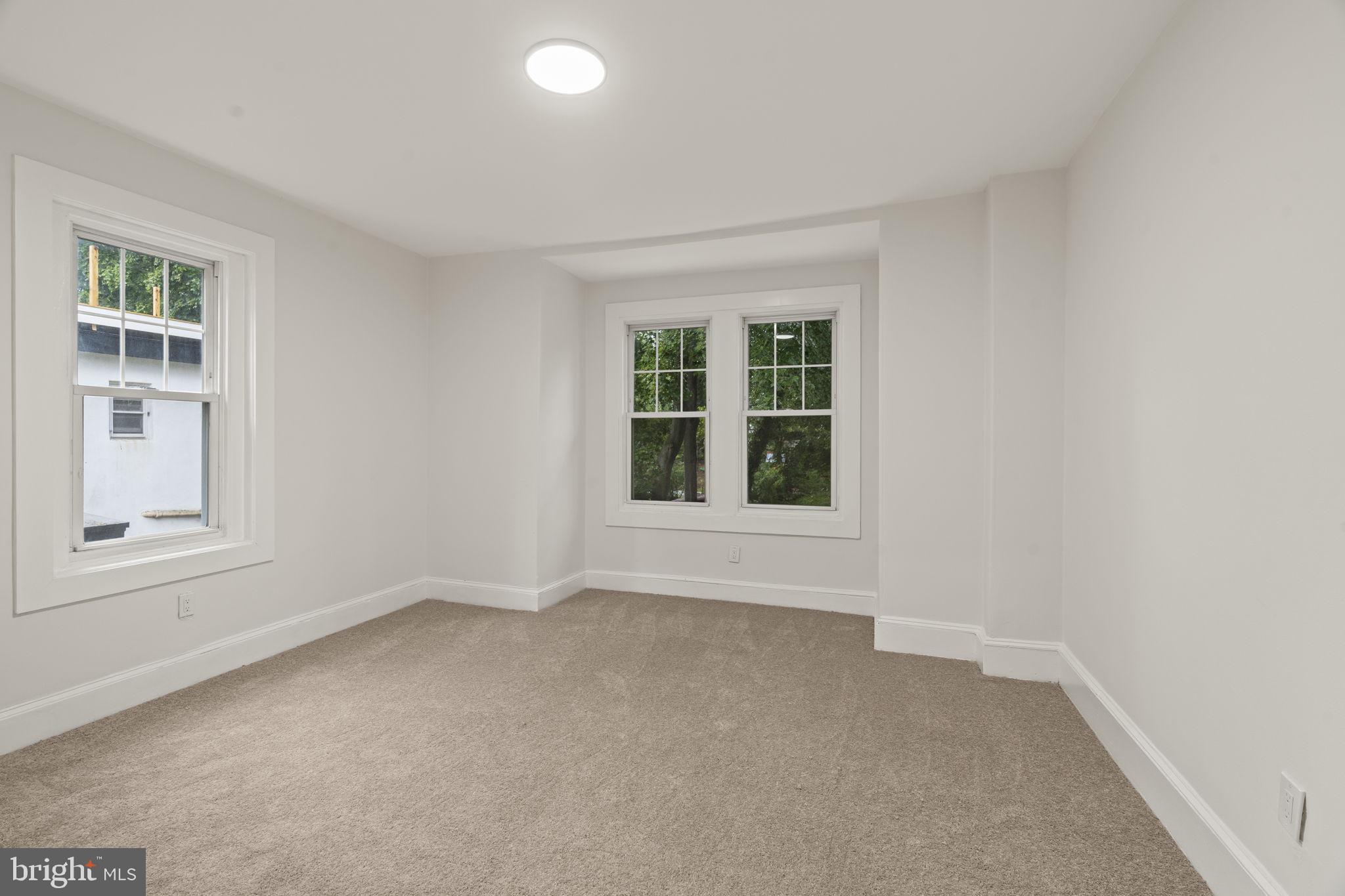 147 Harvey Street Philadelphia, PA 19144 - Photo 20 of 37 an empty room with windows