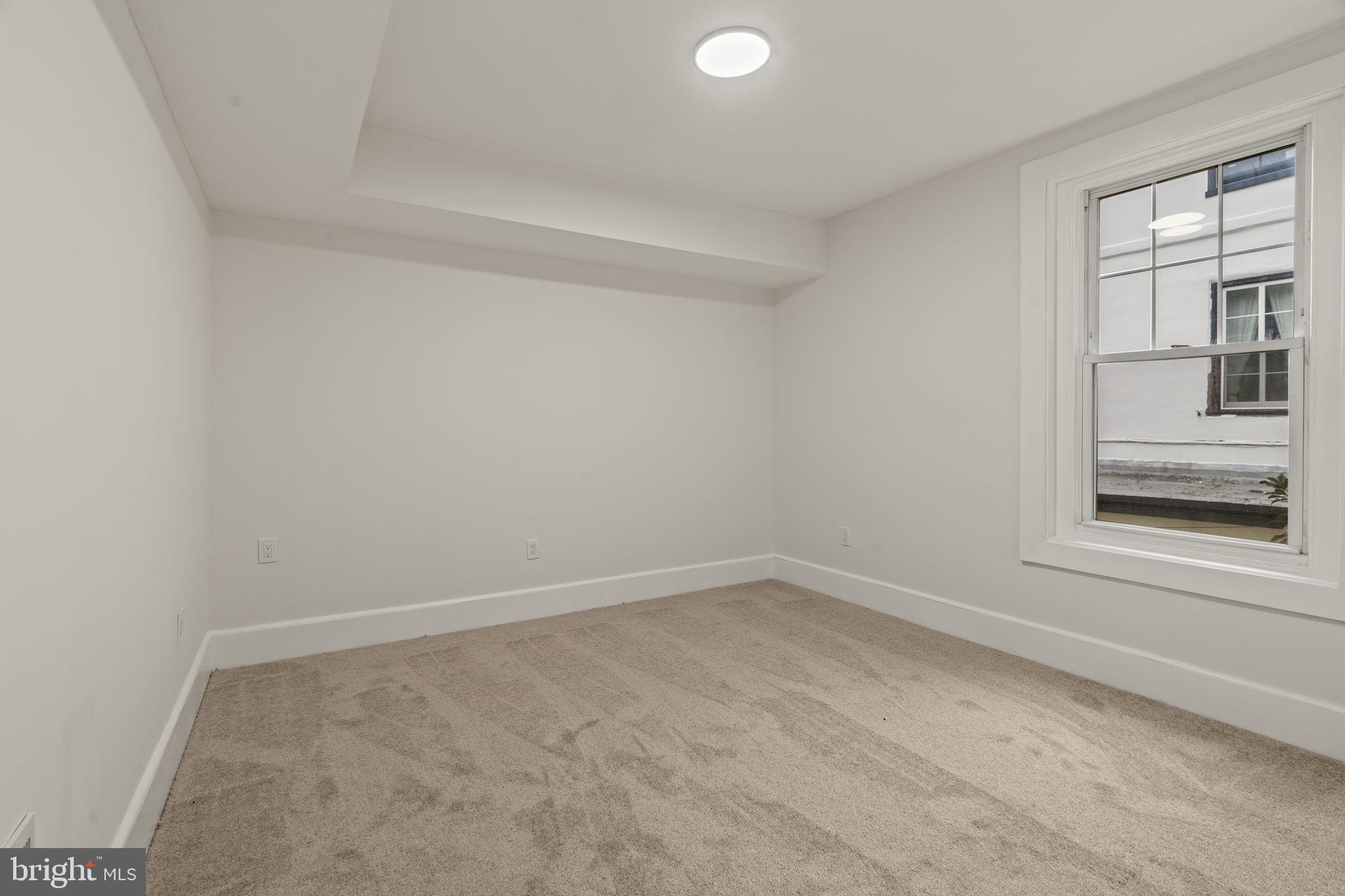 147 Harvey Street Philadelphia, PA 19144 - Photo 22 of 37 an empty room with a window