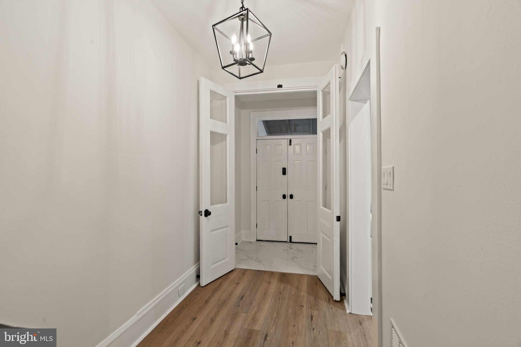 147 Harvey Street Philadelphia, PA 19144 - Photo 27 of 37 a view of a hallway with wooden floor