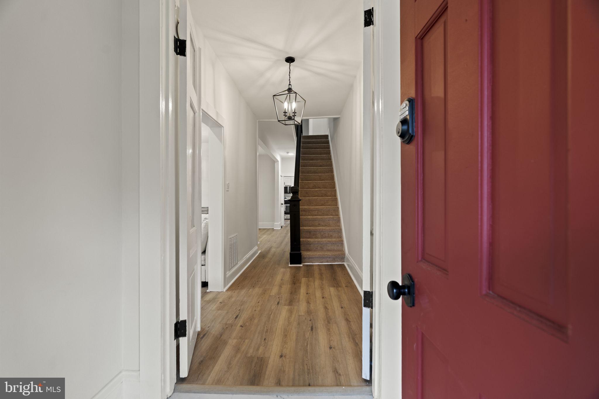 147 Harvey Street Philadelphia, PA 19144 - Photo 28 of 37 a view of a hallway with wooden floor and staircase