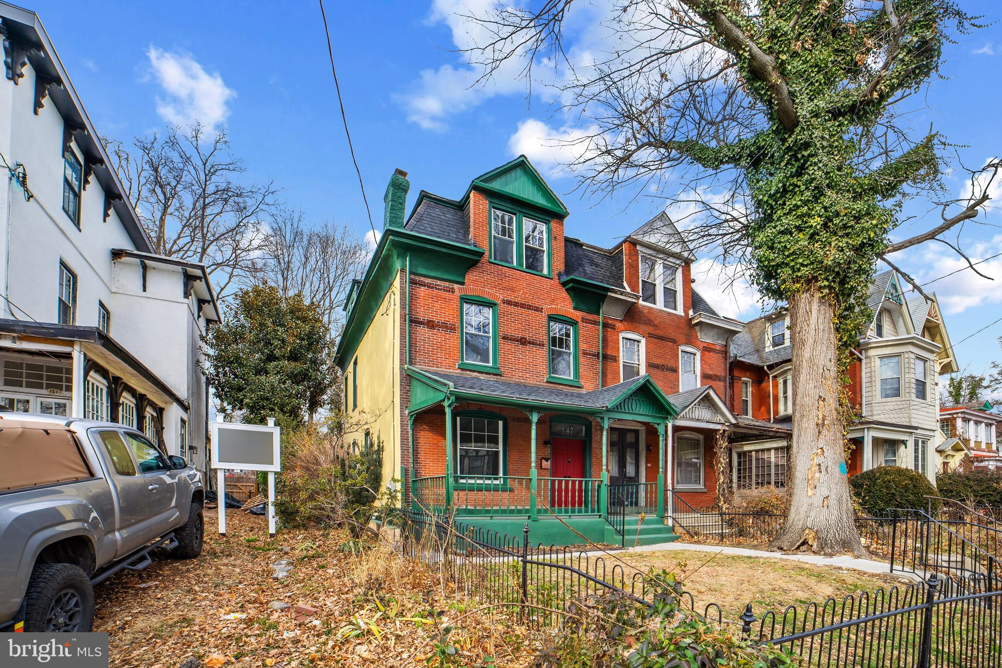 147 Harvey Street Philadelphia, PA 19144 - Photo 36 of 37 a front view of a residential apartment building with a yard