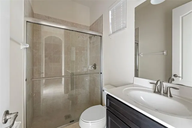 a large bathroom with a sink vanity granite tub and a mirror