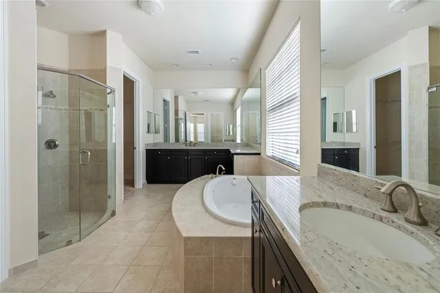 a utility room with sink dryer and washer