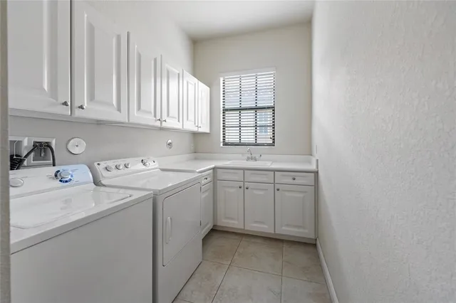 a view of a big building with a big yard and potted plants