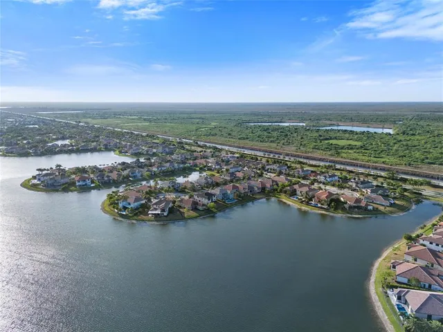 an aerial view of a house with a lake view