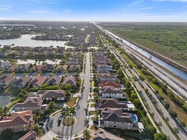 an aerial view of residential houses with outdoor space