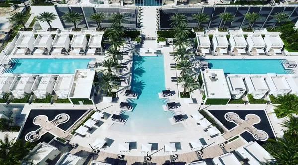 an aerial view of a house with a swimming pool