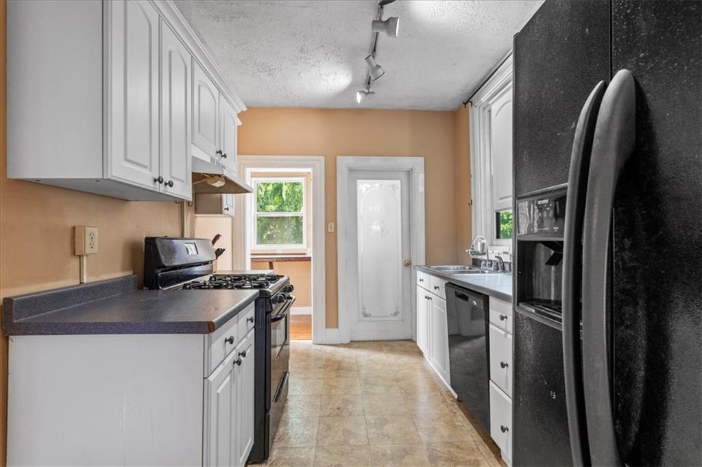 503 Marie Avenue Pittsburgh, PA 15202 - Photo 12 of 31 a kitchen with stainless steel appliances granite countertop a sink stove and refrigerator