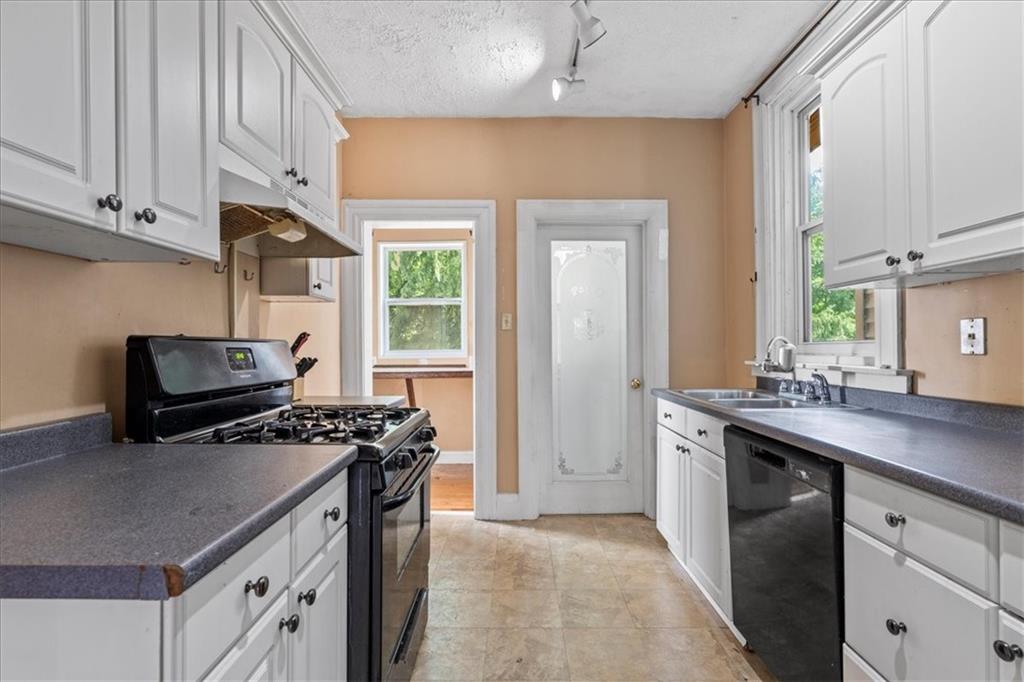503 Marie Avenue Pittsburgh, PA 15202 - Photo 13 of 31 a kitchen with stainless steel appliances a sink stove and cabinets