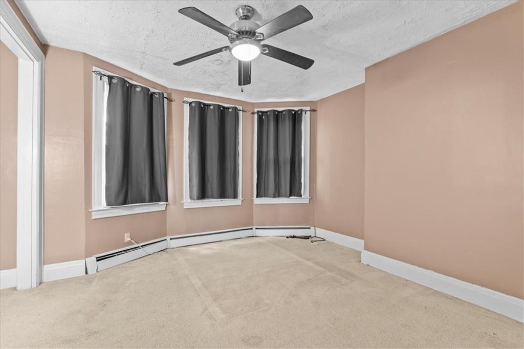 503 Marie Avenue Pittsburgh, PA 15202 - Photo 19 of 31 an empty room with ceiling fan and window