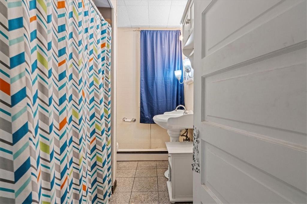 503 Marie Avenue Pittsburgh, PA 15202 - Photo 22 of 31 a bathroom with a sink and a mirror