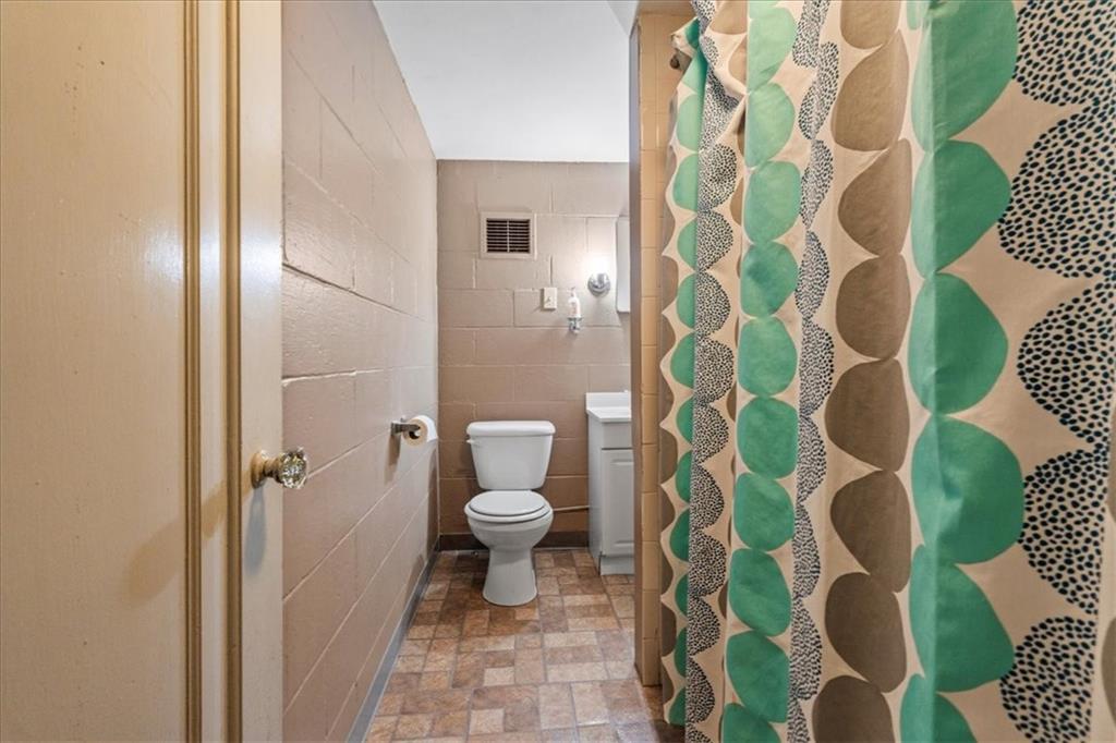503 Marie Avenue Pittsburgh, PA 15202 - Photo 26 of 31 a white toilet sitting next to a shower curtain