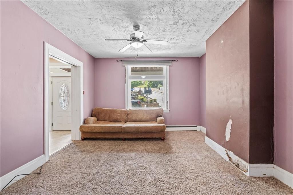 503 Marie Avenue Pittsburgh, PA 15202 - Photo 7 of 31 a living room with furniture and a large window