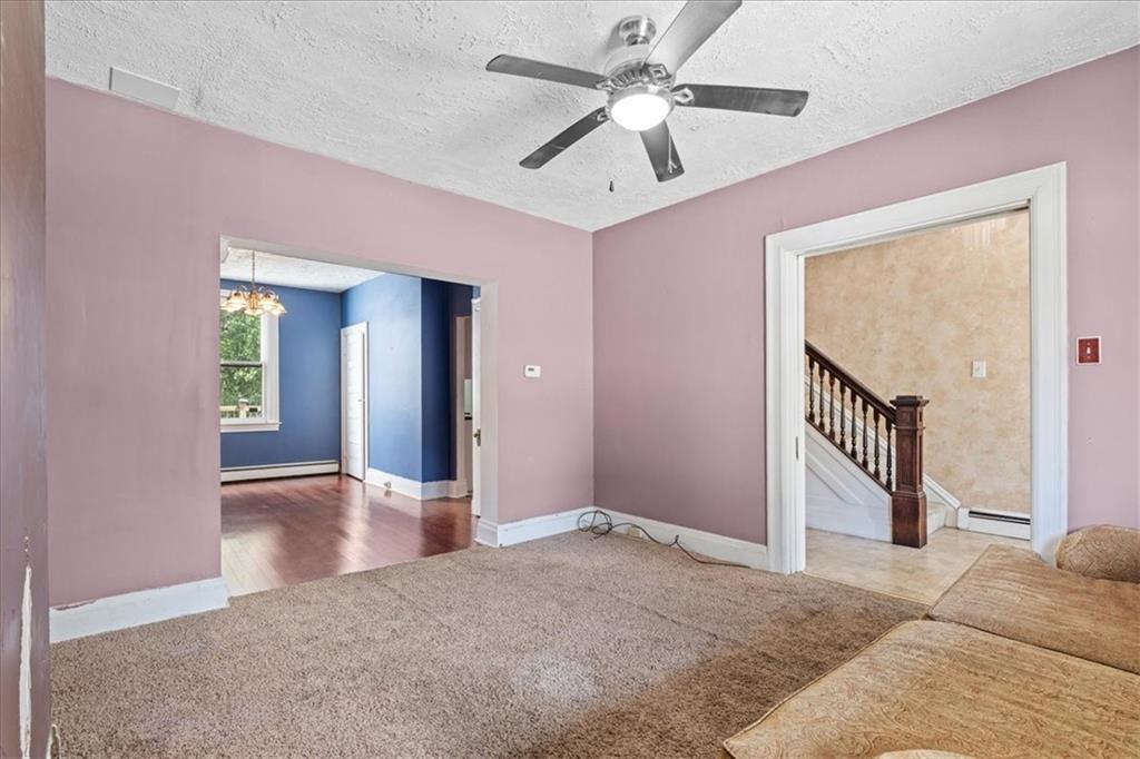 503 Marie Avenue Pittsburgh, PA 15202 - Photo 8 of 31 a view of a livingroom with wooden floor and a ceiling fan