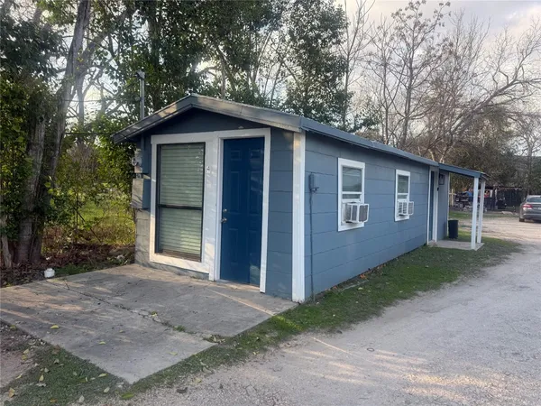 a front view of a house with yard garage