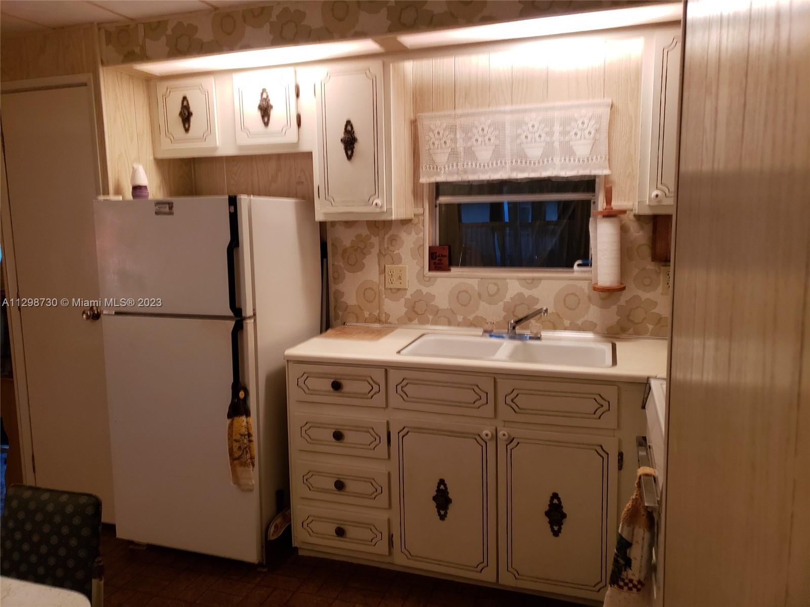 3502 Delaware Sebring, FL 33870 - Photo 11 of 21 a bathroom with a sink and a mirror