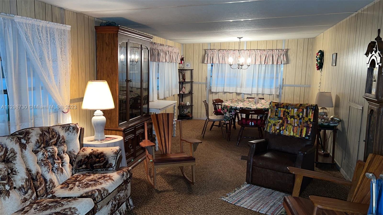 3502 Delaware Sebring, FL 33870 - Photo 2 of 21 a living room with furniture and large windows