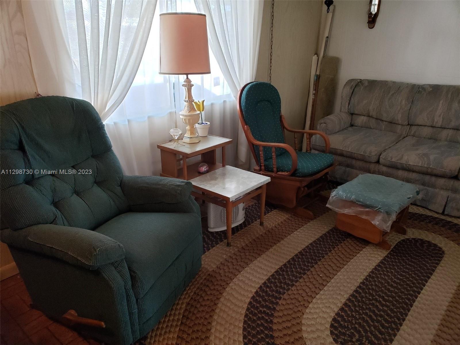 3502 Delaware Sebring, FL 33870 - Photo 5 of 21 a living room with furniture and a lamp