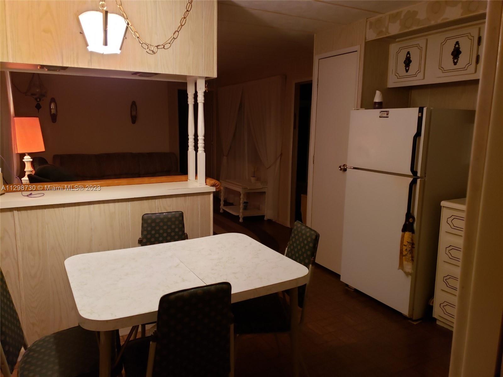 3502 Delaware Sebring, FL 33870 - Photo 8 of 21 a bathroom with a sink a mirror and a toilet