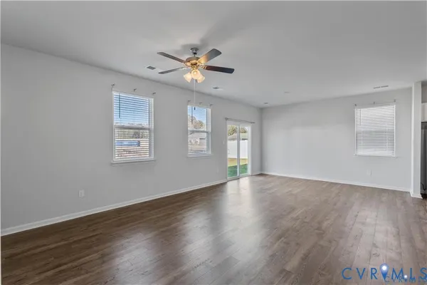 a view of a room with wooden floor and cabinet