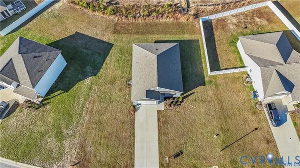 a kitchen with stainless steel appliances granite countertop a kitchen island hardwood floor sink and stove