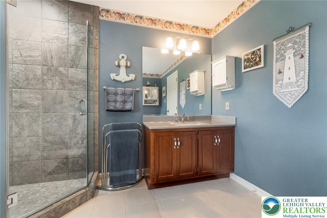 1795 Freier Road Quakertown, PA 18951 - Photo 27 of 69 A well-lit bathroom with a spacious walk-in shower and an elegant vanity.