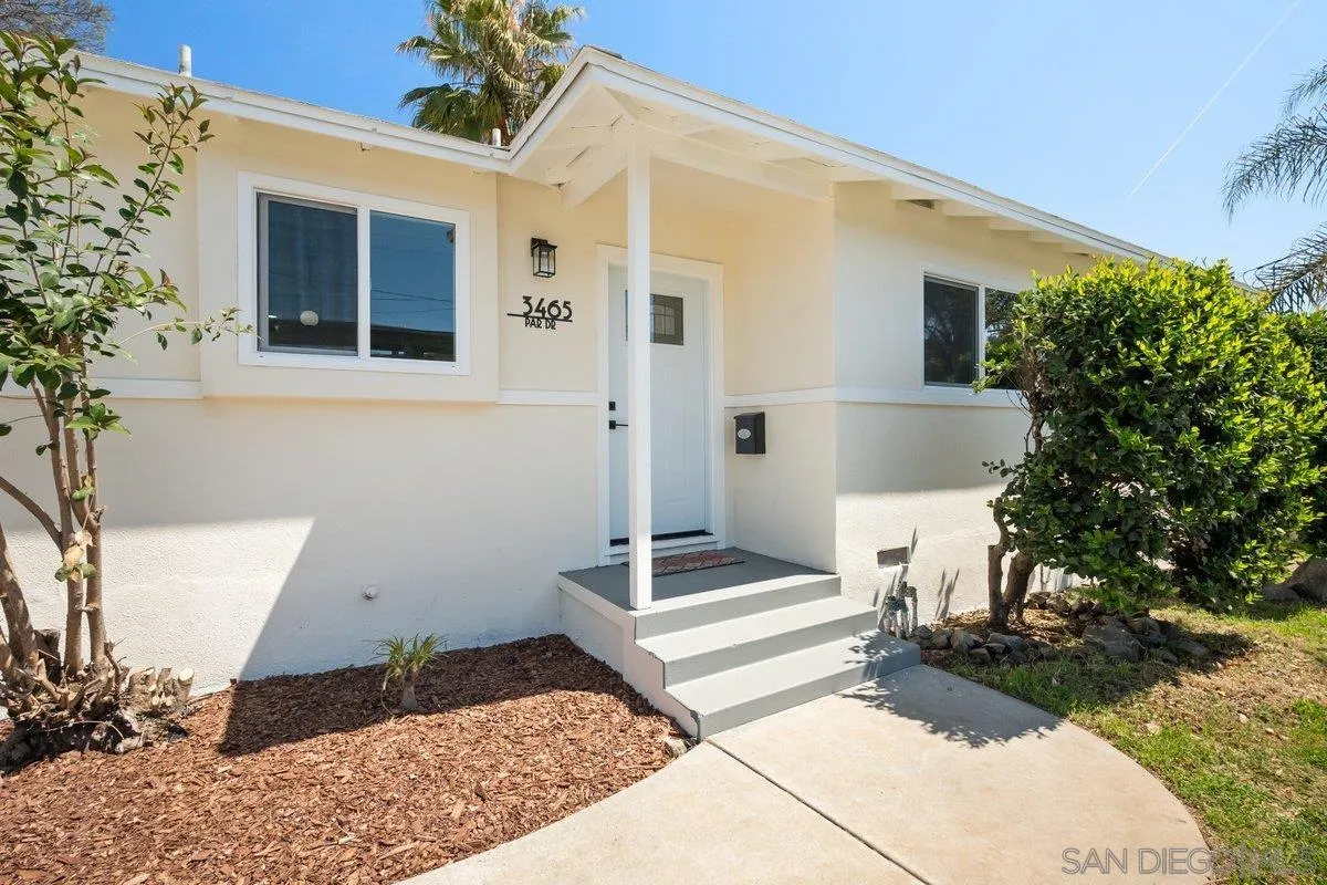 a front view of a house with stairs