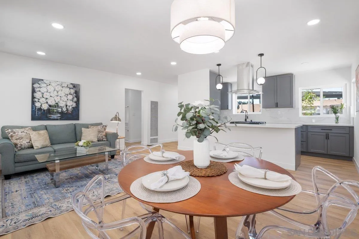 3465 Par Drive La Mesa, CA 91941 - Photo 3 of 16 a dining room with furniture a chandelier and kitchen view