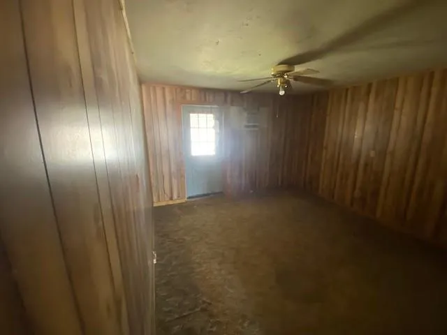 a view of entryway with wooden walls