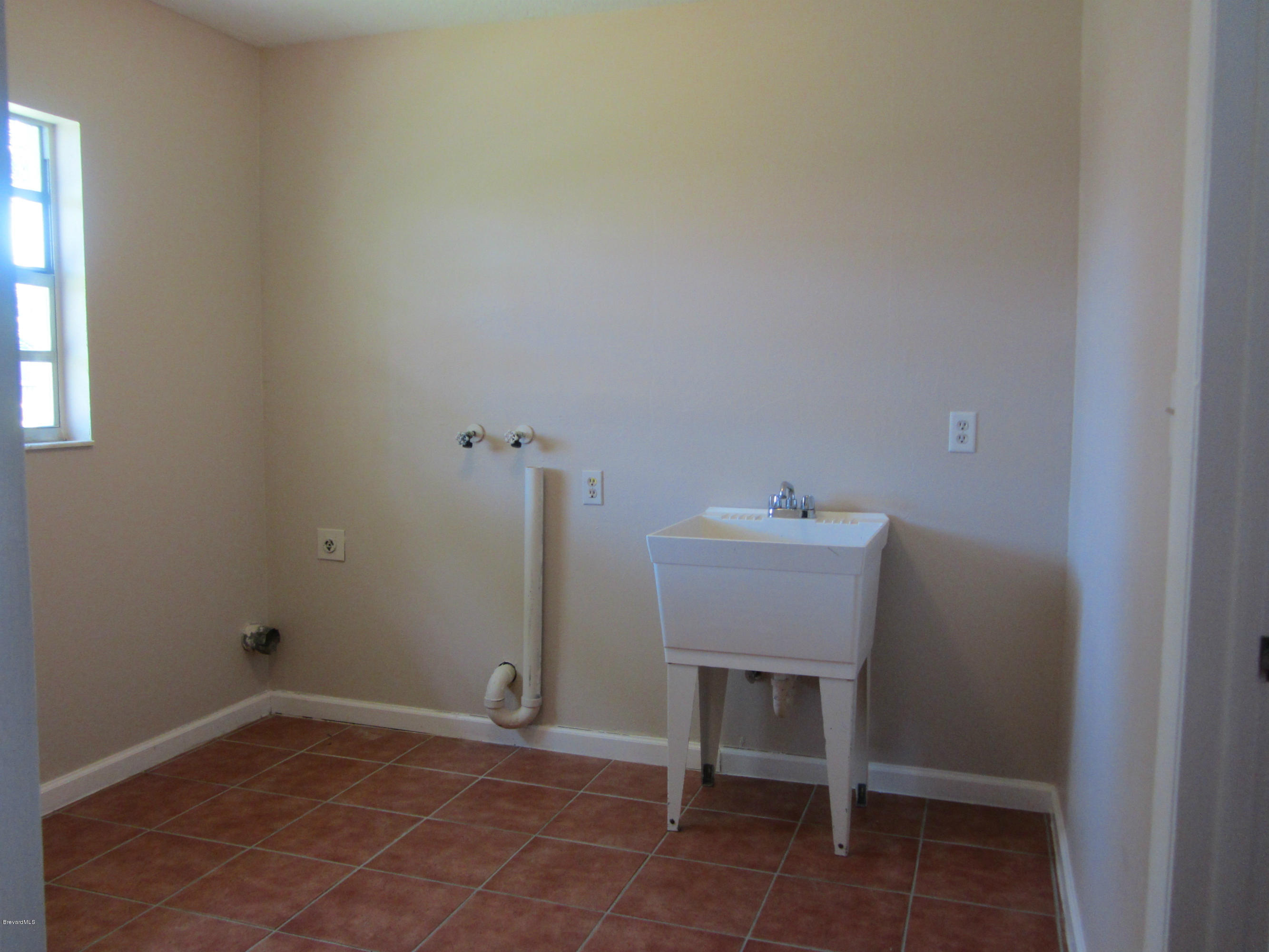 695 Caribbean Road Satellite Beach, FL 32937 - Photo 19 of 19 Inside Laundry room