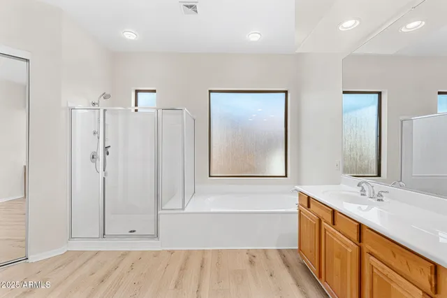 a view of a room with a window and a ceiling fan