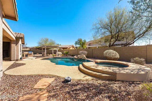 a view of swimming pool outdoor seating