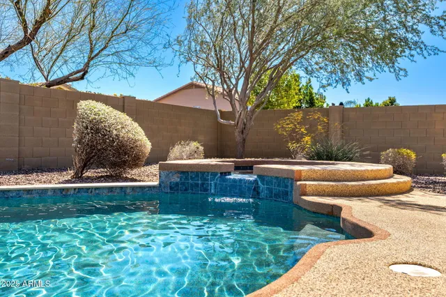a bedroom with a bed and a potted plant