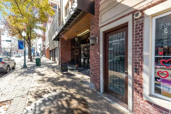 a view of a building with a tree