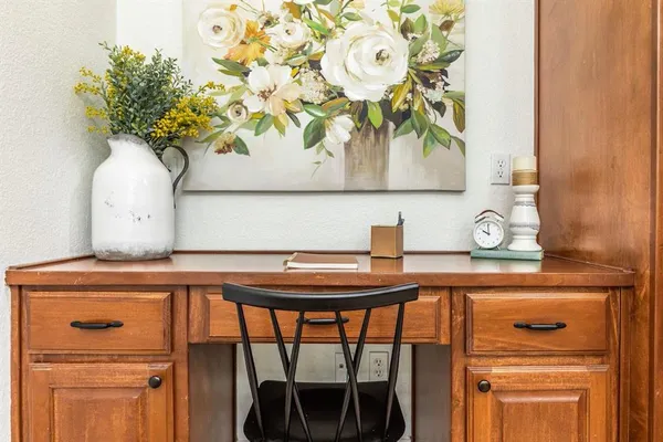 a table with a vase and a vase on it