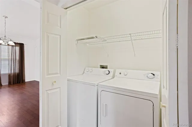 a view of storage and utility room with washer and dryer
