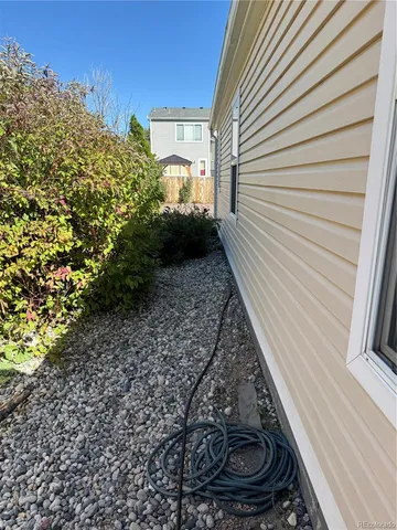 a view of a backyard of the house