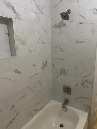 a bathroom with a sink and a shower