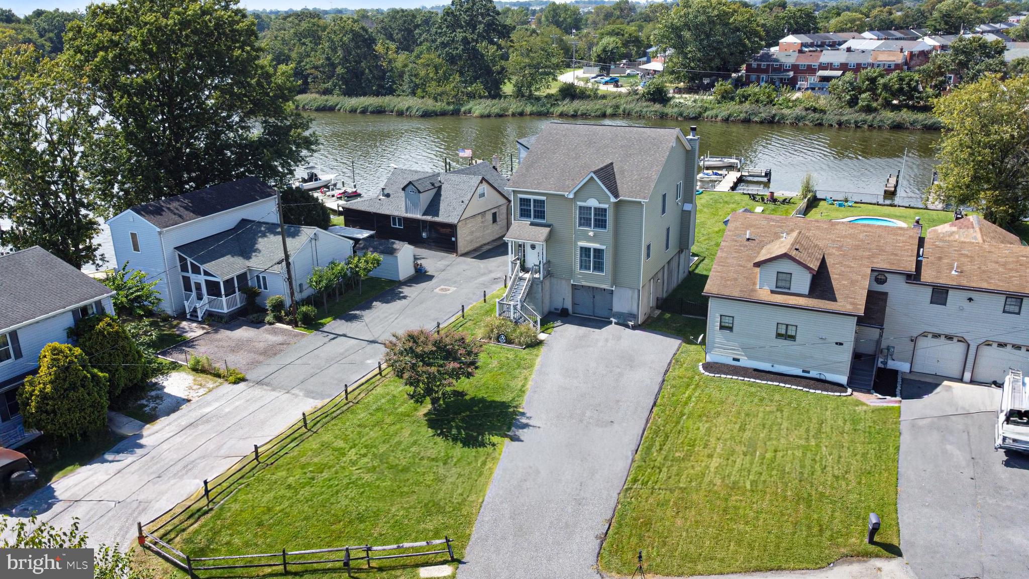 7808 Deboy Avenue Baltimore, MD 21222 - Photo 1 of 36 an aerial view of a house with a lake view