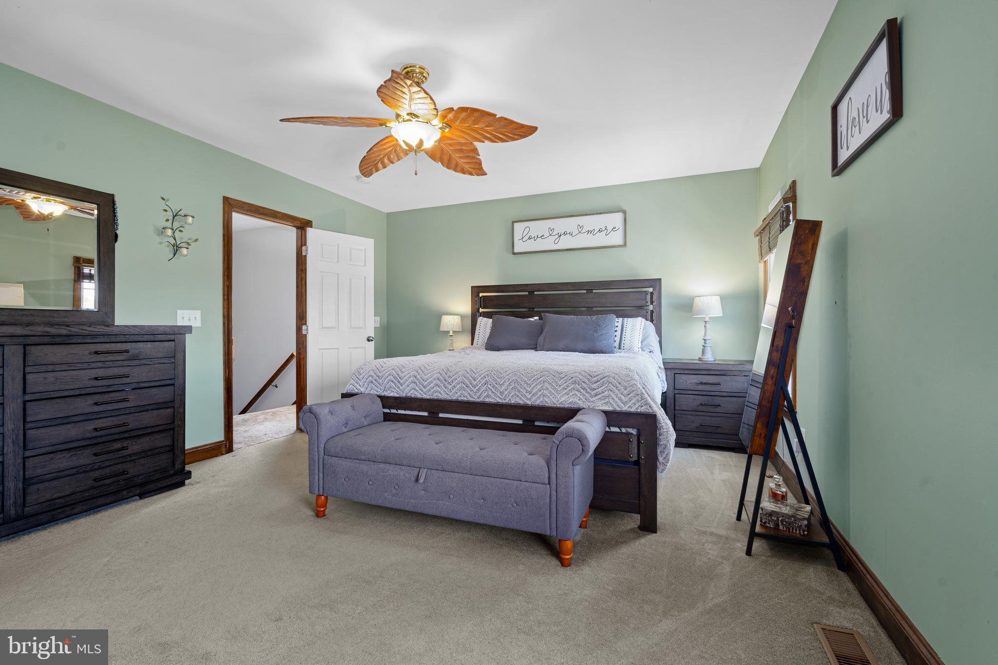 7808 Deboy Avenue Baltimore, MD 21222 - Photo 17 of 36 a bedroom with a bed and a chandelier