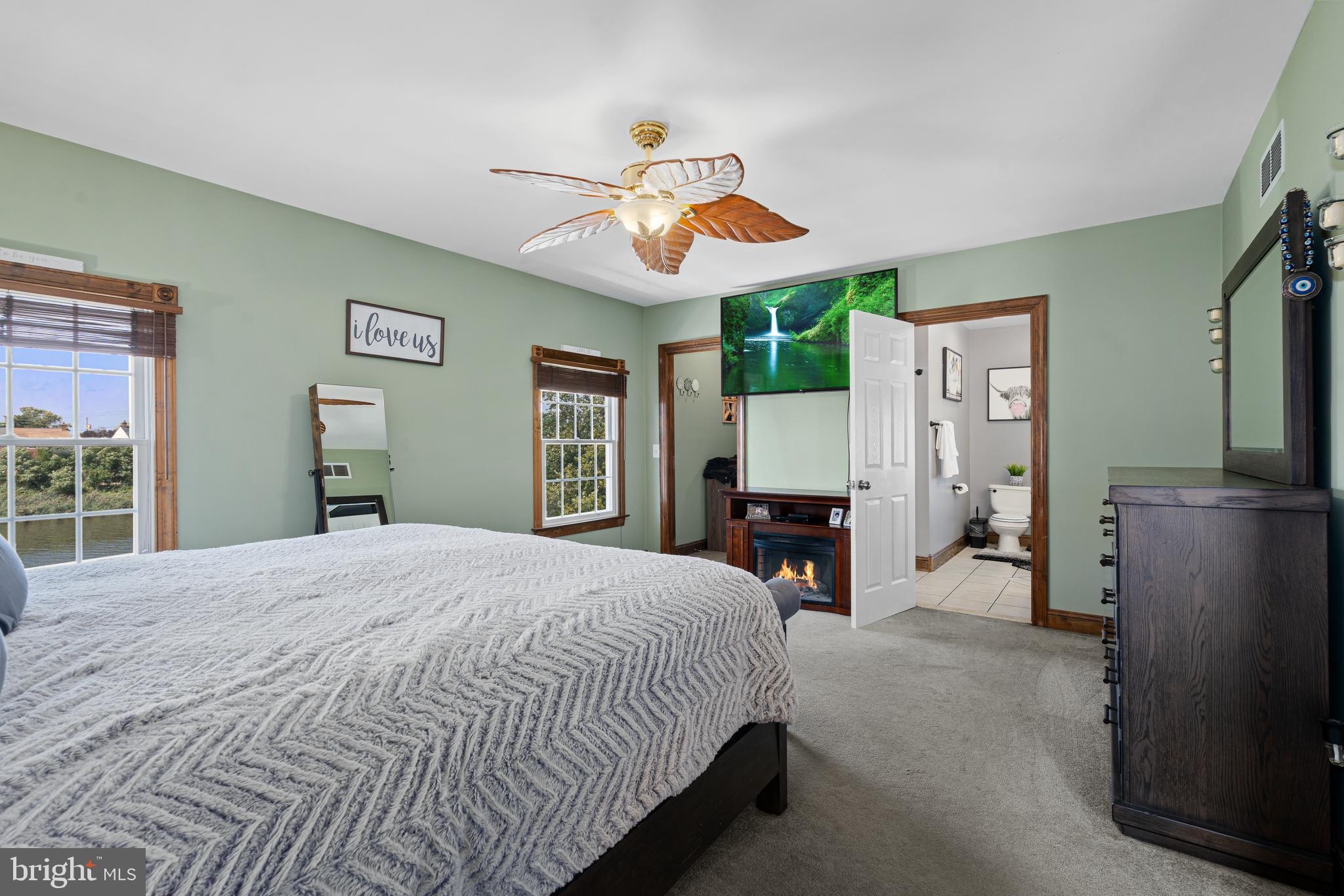 7808 Deboy Avenue Baltimore, MD 21222 - Photo 18 of 36 a bedroom with a bed and a chandelier